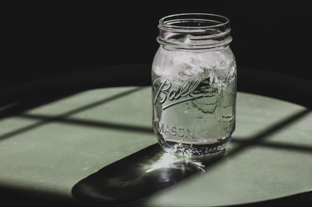 Aason jar full of water to drink.